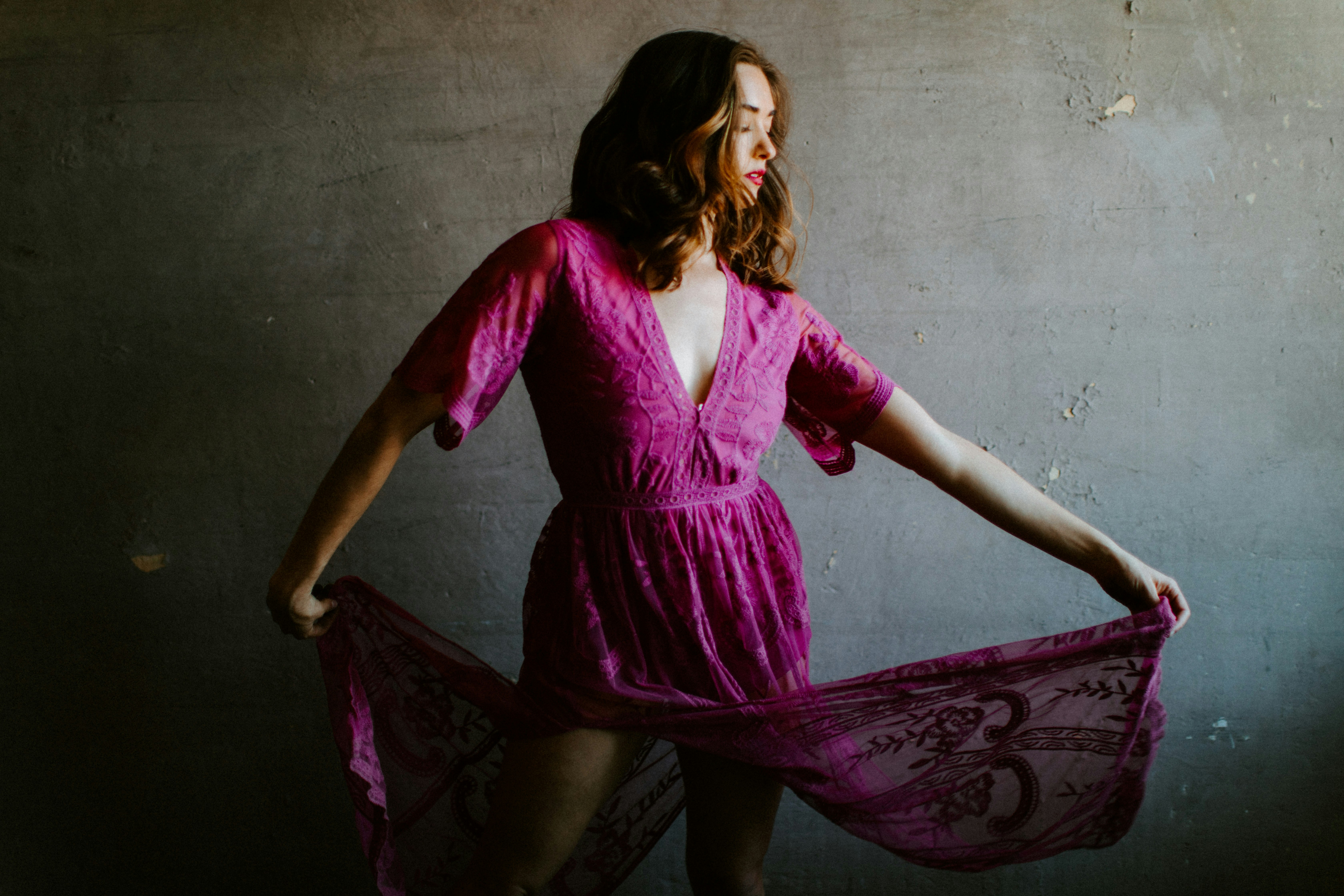 woman in purple long sleeve dress